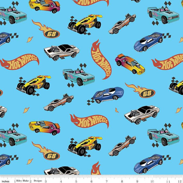 Image of the Flannel Hot Wheels Made to Race Light Blue flannel cotton fabric by Riley Blake Designs. Features hot wheels logos and cars on a blue background. 
Cute Little Fabric Shop