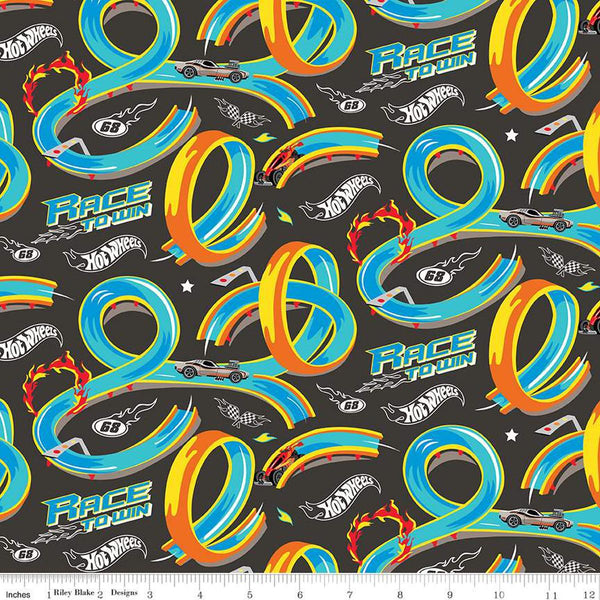 Image of the Hot Wheels Made to Race Track Charcoal quilting cotton fabric by Riley Blake Designs. Official licensed product. Territorial sales restrictions may apply. Features tracks and cars with text on a gray background.
Cute Little Fabric Shop