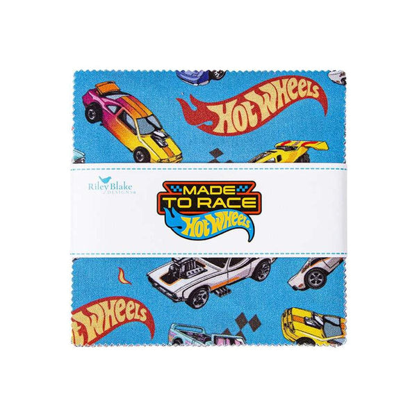 Image of the Hot Wheels Made to Race 5 inch Stacker by Riley Blake Designs. Official licensed product. Features cars, icons, and flames on blue, white, and orange backgrounds. 
Cute Little Fabric Shop