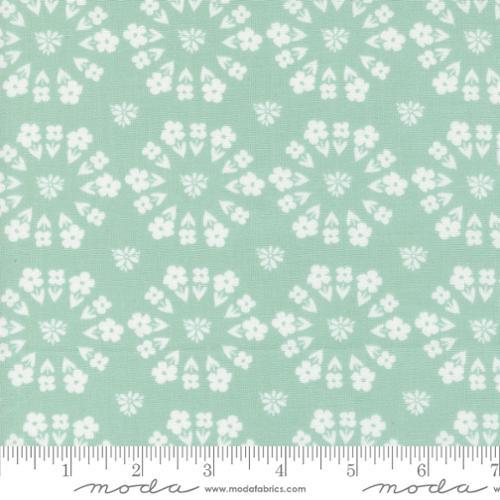 Image of the Laguna Sunrise Paradise Florals Home Town Sky quilting cotton fabric by Sherri & Chelsi for Moda Fabrics. Features small circular flowers on a light mint background. 
Cute Little Fabric Shop