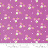Image of the Laguna Sunrise Blossoms Violet quilting cotton fabric by Sherri & Chelsi for Moda Fabrics. Features small flowers on a bright purple background. 
Cute Little Fabric Shop