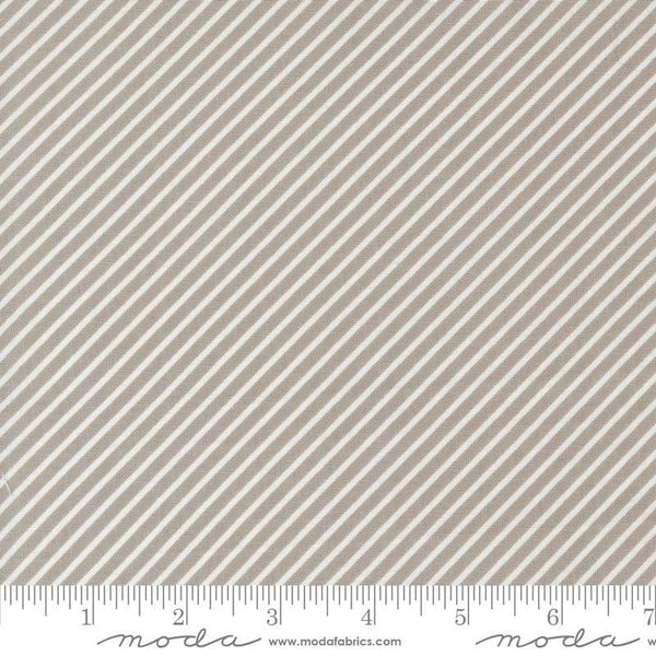 Image of the Laguna Sunrise Stripes Stone quilting cotton fabric by Sherri & Chelsi for Moda Fabrics. Features diagonal stripes on a gray background. 
Cute Little Fabric Shop