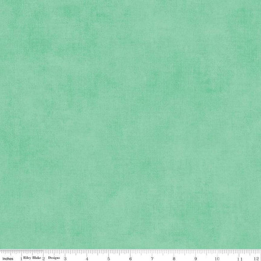 Image of the Shades Sweet Mint quilting cotton fabric by Riley Blake Designs. Features a mint fabric with a mottled semisold background. 
Cute Little Fabric Shop