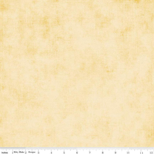 Image of the Shades Sunshine quilting cotton fabric by Riley Blake Designs. Features a light yellow fabric with a mottled semisold background. 
Cute Little Fabric Shop