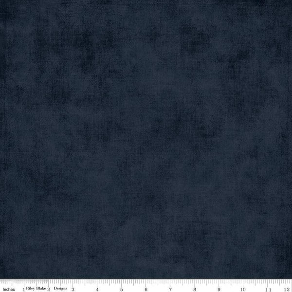 Image of the Shades Midnight quilting cotton fabric by Riley Blake Designs. Features a dark blue fabric with a mottled semisold background. 
Cute Little Fabric Shop