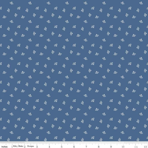 Image of the Prim Blossom Denim quilting cotton fabric by Lori Holt for Riley Blake Designs. Features small blossoms on a dark blue background.
Cute Little Fabric Shop