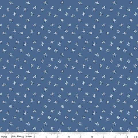 Image of the Prim Blossom Denim quilting cotton fabric by Lori Holt for Riley Blake Designs. Features small blossoms on a dark blue background.
Cute Little Fabric Shop