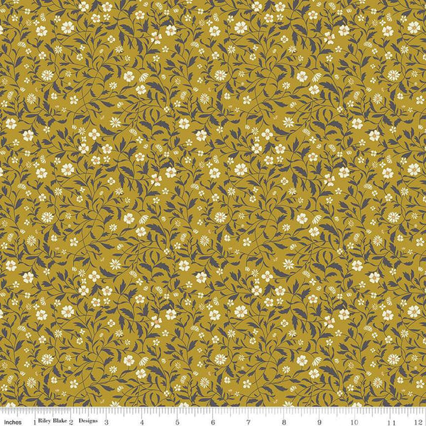 Image of the Wanderlust Hawthorn Curry quilting cotton fabric by Danelys Sidron for Riley Blake Designs. Features vines and flowers on a yellow green background. 
Cute Little Fabric Shop