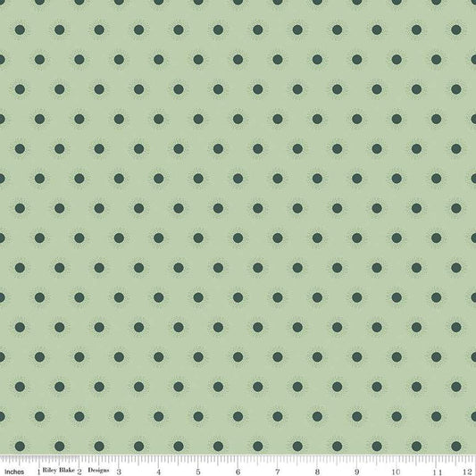 Image of the Wanderlust Sunshine Light Green quilting cotton fabric by Danelys Sidron for Riley Blake Designs. Features an array of small suns on a light pale green background. 
Cute Little Fabric Shop