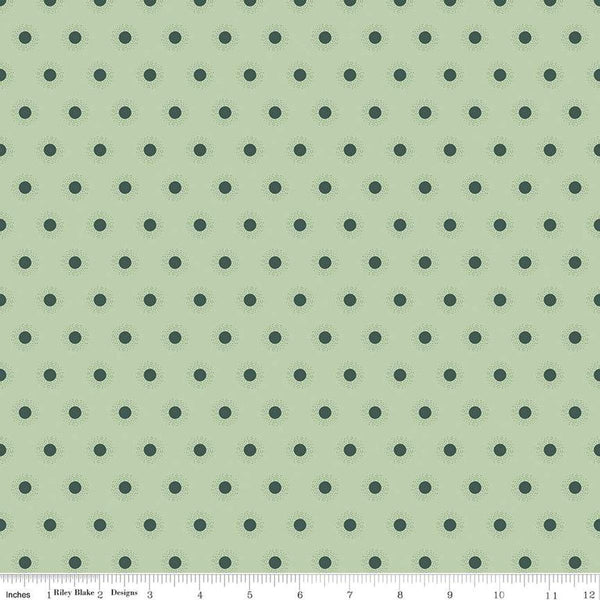 Image of the Wanderlust Sunshine Light Green quilting cotton fabric by Danelys Sidron for Riley Blake Designs. Features an array of small suns on a light pale green background. 
Cute Little Fabric Shop