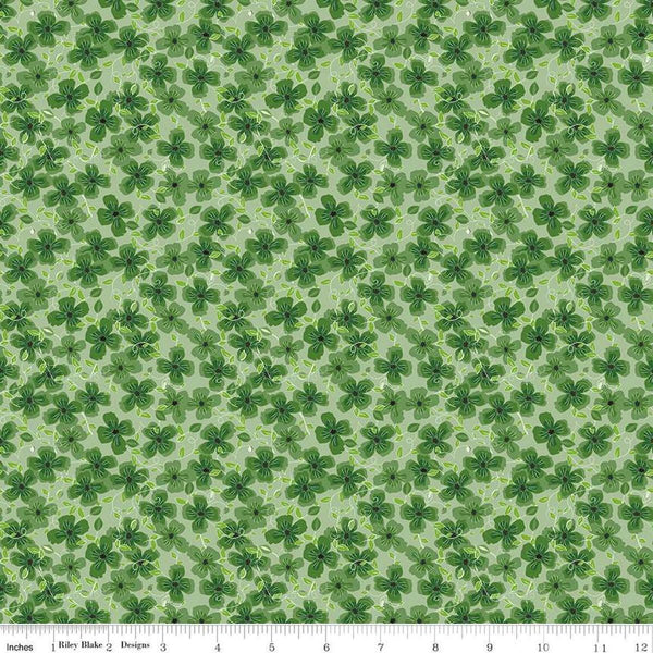 Image of the Perennial Clematis Green quilting cotton fabric by Jill Finley for Riley Blake Designs. Features flowers clustered on a light green background. 
Cute Little Fabric Shop