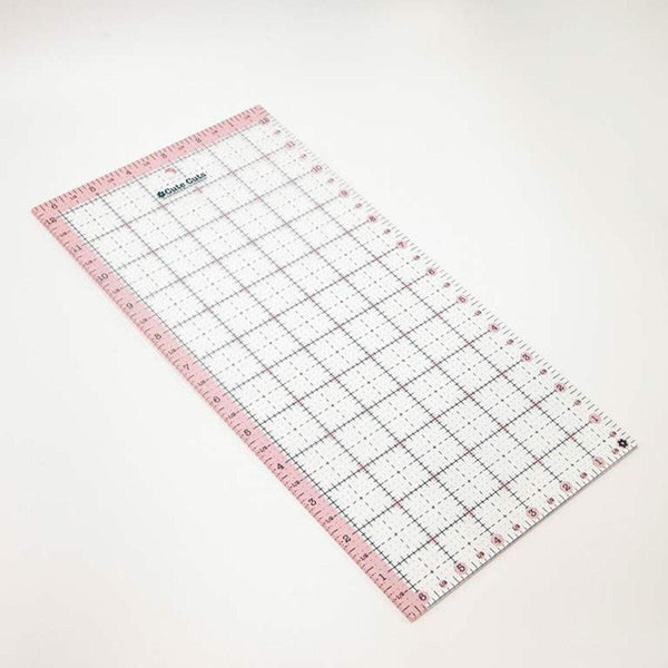 Image of the Cute Cuts™ Ruler 6 1/2&quot; x 12 1/2&quot; by Lori Holt for Riley Blake Designs. Features a ruler with a pink border. 
Cute Little Fabric Shop