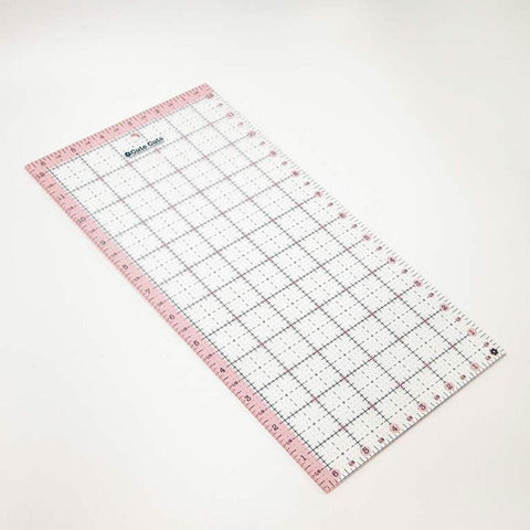 Image of the Cute Cuts™ Ruler 6 1/2&quot; x 12 1/2&quot; by Lori Holt for Riley Blake Designs. Features a ruler with a pink border. 
Cute Little Fabric Shop