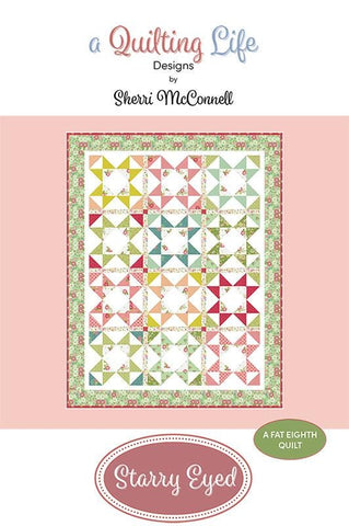 Image of the Starry Eyed quilt pattern by A Quilting Life for Moda Fabrics. Features star patterns on a white background. 
Cute Little Fabric Shop