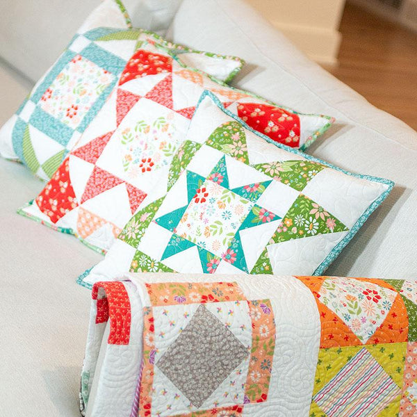 Image of the Family Favorites quilt pattern by Its Sew Emma for Moda Fabrics. Features pillows with quilt blocks.
Cute Little Fabric Shop