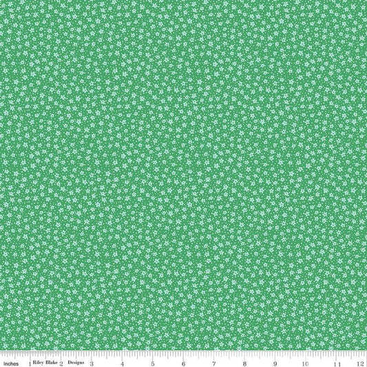 Image of the Playtime 30s Ditsy Kelly quilting cotton fabric by Lindsay Wilkes for Riley Blake Designs. Features small scattered flowers and small dots on a dark green background. 
Cute Little Fabric Shop