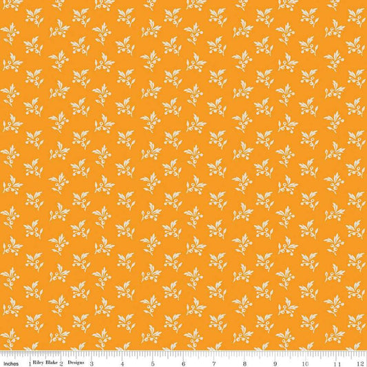 Image of the Cheddar at Twilight Sprigs Cheddar quilting cotton fabric by Riley Blake Designs. Features small scattered sprigs of leaves and berries on a dark orange background. 
Cute Little Fabric Shop