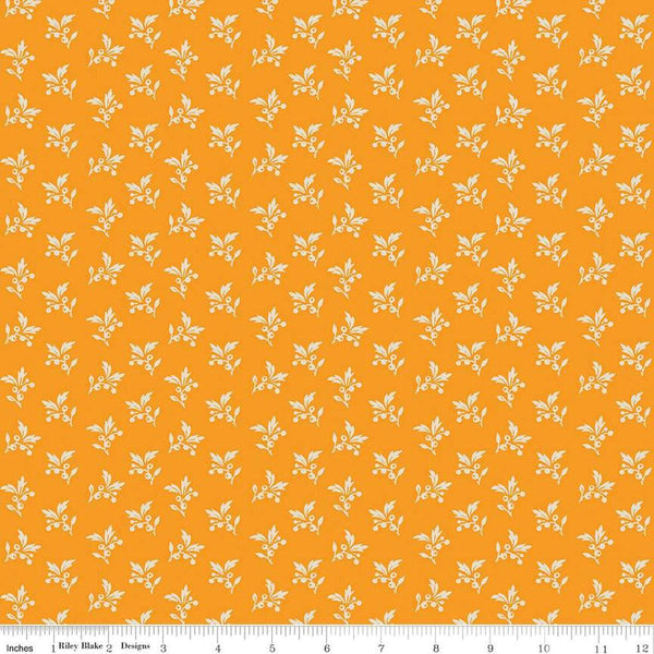 Image of the Cheddar at Twilight Sprigs Cheddar quilting cotton fabric by Riley Blake Designs. Features small scattered sprigs of leaves and berries on a dark orange background. 
Cute Little Fabric Shop