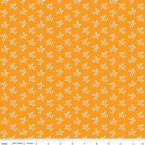 Image of the Cheddar at Twilight Sprigs Cheddar quilting cotton fabric by Riley Blake Designs. Features small scattered sprigs of leaves and berries on a dark orange background. 
Cute Little Fabric Shop