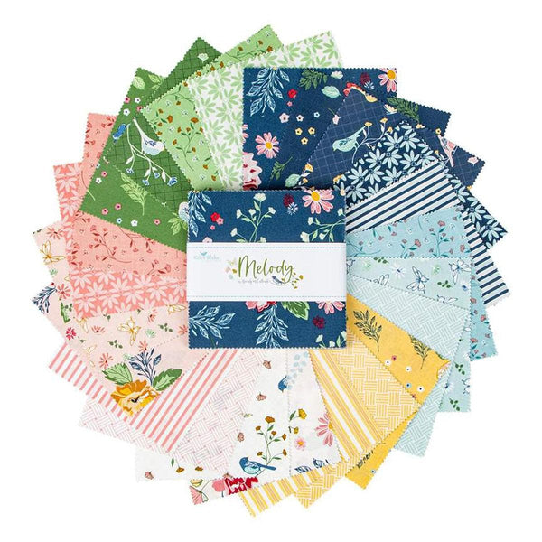 Image of the Melody 5 inch stacker by Beverly McCullough for Riley Blake Designs. Features blue, pink, green, yellow, and cream floral fabrics. 
Cute Little Fabric Shop