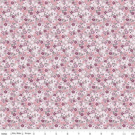 Image of the Buds & Butterflies Daisy Delight Mauve quilting cotton fabric by Cayla Naylor for Riley Blake Designs. Features small flowers on a pink purple background. 
Cute Little Fabric Shop