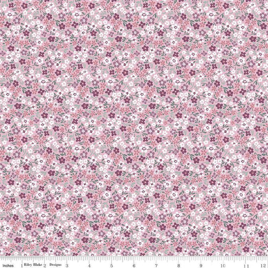 Image of the Buds & Butterflies Daisy Delight Mauve quilting cotton fabric by Cayla Naylor for Riley Blake Designs. Features small flowers on a pink purple background. 
Cute Little Fabric Shop