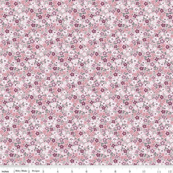 Image of the Buds & Butterflies Daisy Delight Mauve quilting cotton fabric by Cayla Naylor for Riley Blake Designs. Features small flowers on a pink purple background. 
Cute Little Fabric Shop