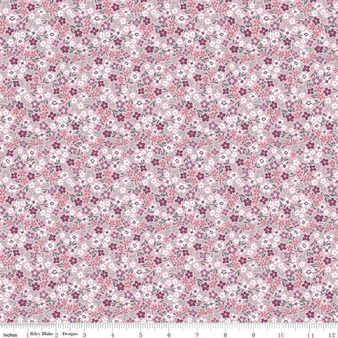 Image of the Buds & Butterflies Daisy Delight Mauve quilting cotton fabric by Cayla Naylor for Riley Blake Designs. Features small flowers on a pink purple background. 
Cute Little Fabric Shop