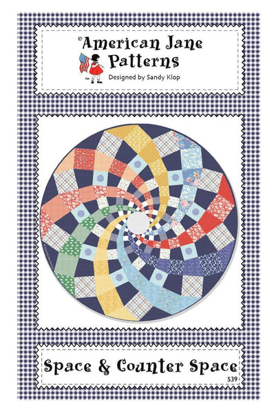 Image of the Space and Counter Space quilt pattern by American Jane for Riley Blake Designs. Features a swirl pattern in a circle. 
Cute Little Fabric Shop