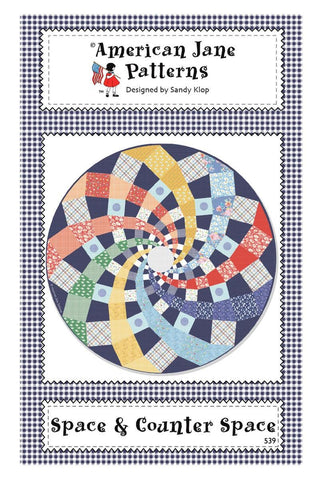 Image of the Space and Counter Space quilt pattern by American Jane for Riley Blake Designs. Features a swirl pattern in a circle. 
Cute Little Fabric Shop