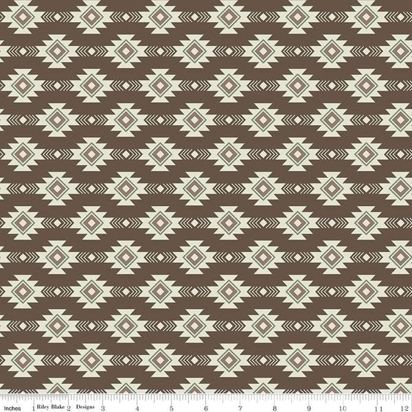 Image of the Lets Get Lost in the Woods Geometric Brown quilting cotton fabric by Tara Reed for Riley Blake Designs. Features a geometric striped design on a dark brown background. 
Cute Little Fabric Shop