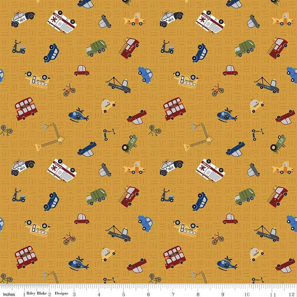 Image of the It Takes a Village Traffic Jam Honey quilting cotton fabric by Jennifer Long for Riley Blake Designs. Features scattered vehicles on a tone-on-tone textured yellow background. 
Cute Little Fabric Shop