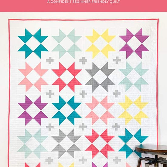 Image of the Stellar Flare Quilt Pattern by Fran Gulick for Riley Blake Designs. Features star blocks on a white background.
Cute Little Fabric Shop