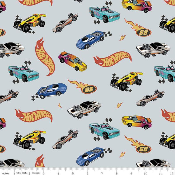 Image of the Flannel Hot Wheels Made to Race Gray flannel cotton fabric by Riley Blake Designs. Features hot wheels logos and cars on a gray background. 
Cute Little Fabric Shop