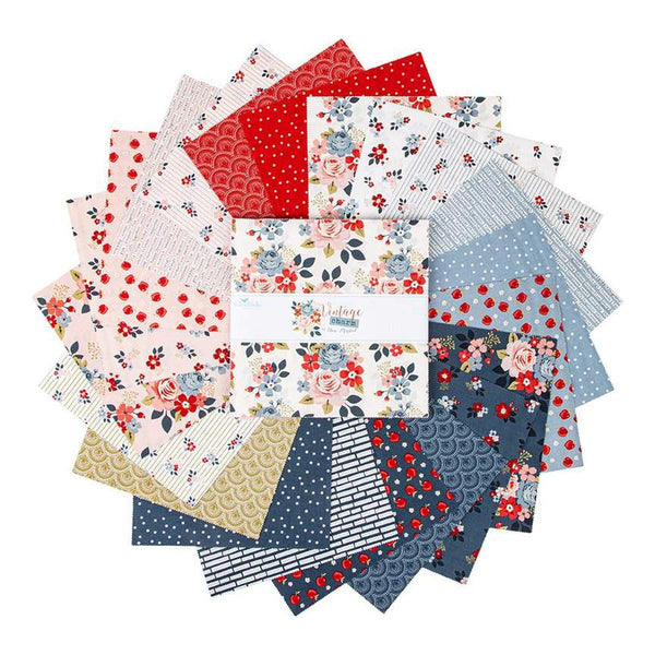 Image of the Vintage Charm 10 inch stacker by Dani Mogstad for Riley Blake Designs. Features white, red, and blue fabrics with floral patterns. 
Cute Little Fabric Shop