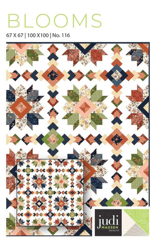 Image of the Blooms quilt pattern by Judy Madsen for Riley Blake Designs. Features stars, diamonds, and square patterns on a quilt. 
Cute Little Fabric Shop