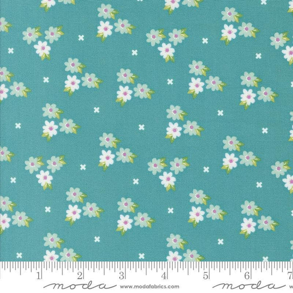 Image of the Laguna Sunrise Blossoms Teal quilting cotton fabric by Sherri & Chelsi for Moda Fabrics. Features small flowers on a bright teal background. 
Cute Little Fabric Shop