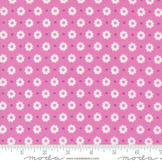 Image of the Laguna Sunrise Floral Dot Sweet Pea quilting cotton fabric by Sherri & Chelsi for Moda Fabrics. Features small flowers on a pink purple background. 
Cute Little Fabric Shop