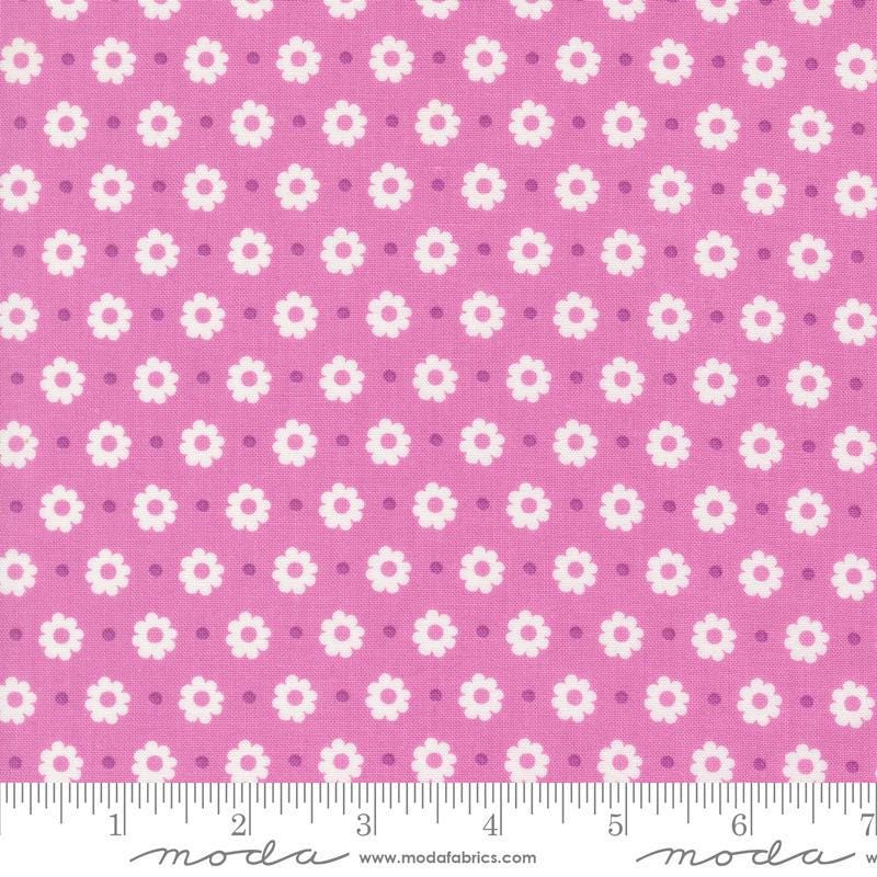 Image of the Laguna Sunrise Floral Dot Sweet Pea quilting cotton fabric by Sherri & Chelsi for Moda Fabrics. Features small flowers on a pink purple background. 
Cute Little Fabric Shop