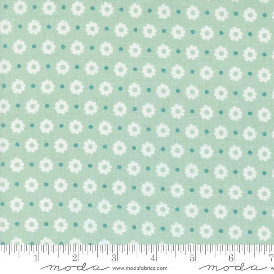 Image of the Laguna Sunrise Floral Dot Home Town Sky quilting cotton fabric by Sherri & Chelsi for Moda Fabrics. Features small flowers on a light mint background. 
Cute Little Fabric Shop