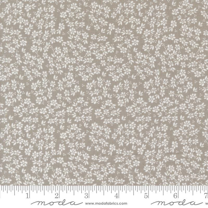 Image of the Laguna Sunrise Small Flowers Stone quilting cotton fabric by Sherri & Chelsi for Moda Fabrics. Features small scattered flowers on a gray background. 
Cute Little Fabric Shop