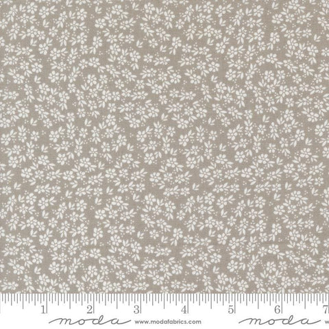Image of the Laguna Sunrise Small Flowers Stone quilting cotton fabric by Sherri & Chelsi for Moda Fabrics. Features small scattered flowers on a gray background. 
Cute Little Fabric Shop