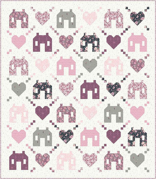 Image of the Friendly Neighborhood quilt pattern by Wendy Sheppard for Riley Blake Designs. Features houses and hearts on a white quilt pattern. 
Cute Little Fabric Shop