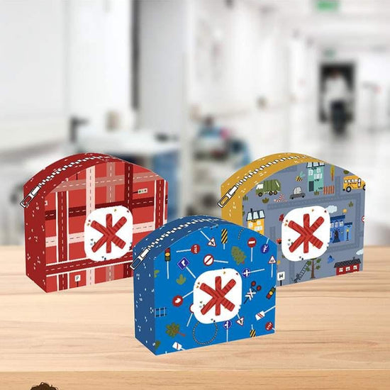 Image of the First Aid Kit pattern by Jennifer Long for Riley Blake Designs. Features three different first aid kits in grey, red, and blue. 
Cute Little Fabric Shop