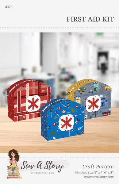 Image of the First Aid Kit pattern by Jennifer Long for Riley Blake Designs. Features three different first aid kits in grey, red, and blue. 
Cute Little Fabric Shop