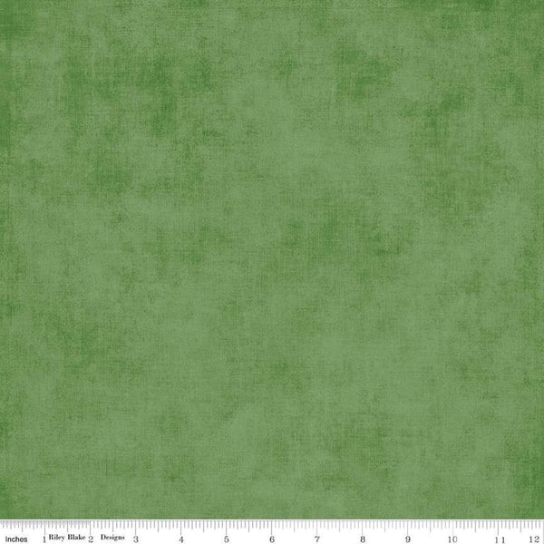 Image of the Shades Treetop quilting cotton fabric by Riley Blake Designs. Features a medium green fabric with a mottled semisold background. 
Cute Little Fabric Shop