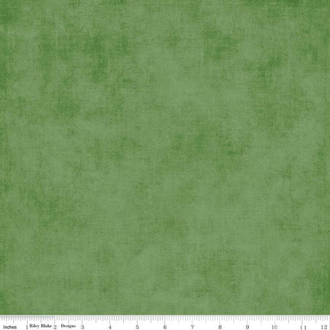 Image of the Shades Treetop quilting cotton fabric by Riley Blake Designs. Features a medium green fabric with a mottled semisold background. 
Cute Little Fabric Shop