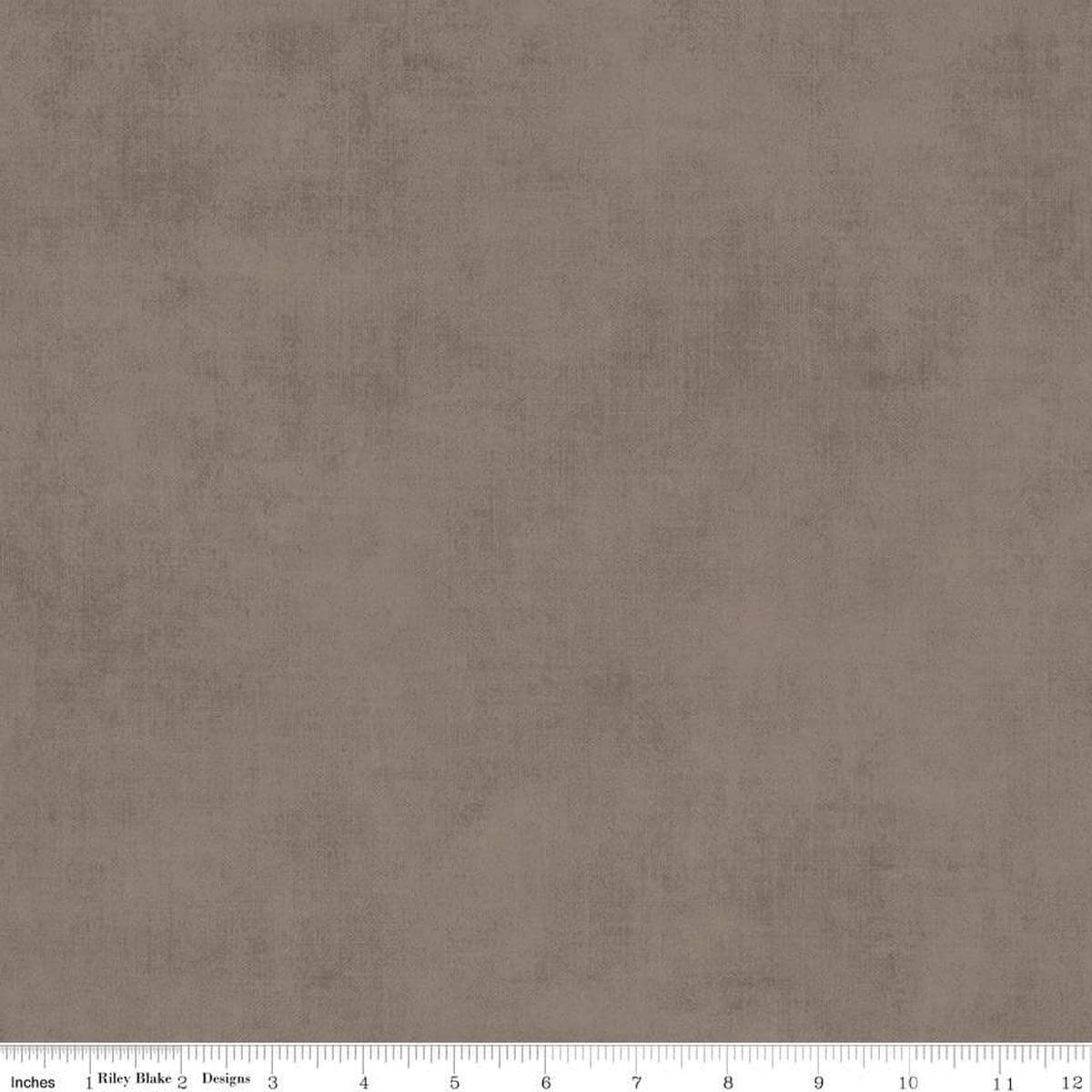Image of the Shades Pebble quilting cotton fabric by Riley Blake Designs. Features a grey brown fabric with a mottled semisold background. 
Cute Little Fabric Shop