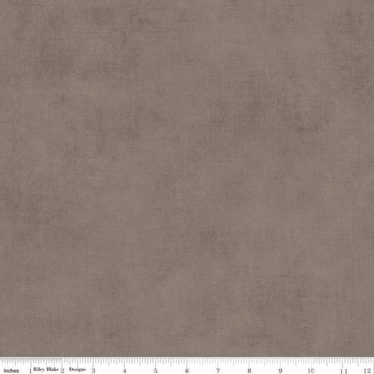 Image of the Shades Pebble quilting cotton fabric by Riley Blake Designs. Features a grey brown fabric with a mottled semisold background. 
Cute Little Fabric Shop