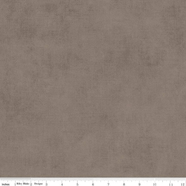 Image of the Shades Pebble quilting cotton fabric by Riley Blake Designs. Features a grey brown fabric with a mottled semisold background. 
Cute Little Fabric Shop